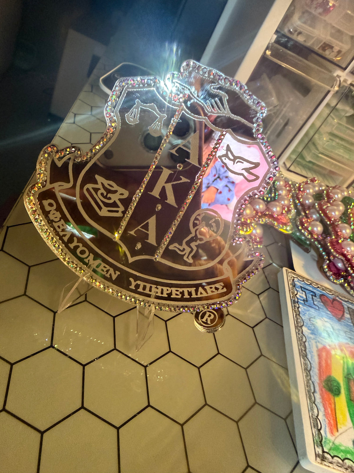 The Fully Engraved AKA® Shield Acrylic Pin ™