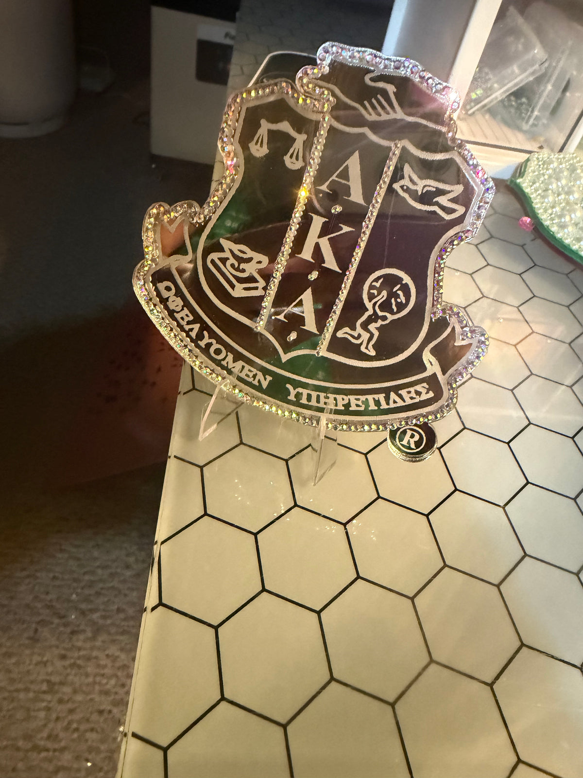 The Fully Engraved AKA® Shield Acrylic Pin ™